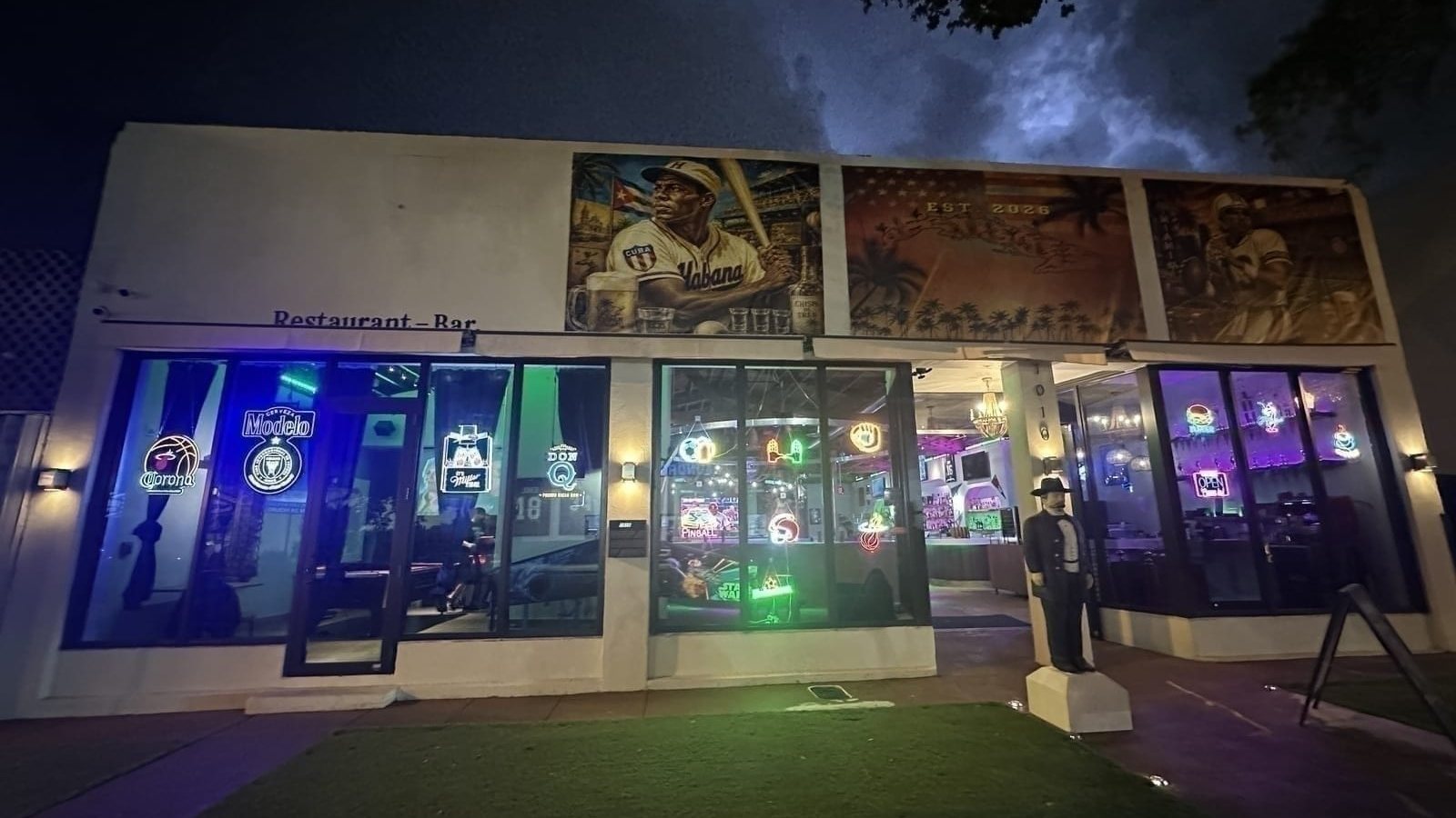 Calle 8 Sports Bar and Grill storefront at night on SW 8th Street in Little Havana